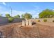 Backyard with water feature, mature shade trees and gravel landscaping for easy care at 13304 W Palo Verde Dr, Litchfield Park, AZ 85340