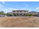 Expansive backyard featuring a large two-story home with a spacious patio, perfect for outdoor entertaining at 13304 W Palo Verde Dr, Litchfield Park, AZ 85340