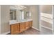 Bathroom featuring double sink vanity, modern lighting, and clean design at 13304 W Palo Verde Dr, Litchfield Park, AZ 85340