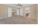 Spacious bedroom with a view to the bathroom and an open hall for modern living at 13304 W Palo Verde Dr, Litchfield Park, AZ 85340
