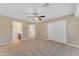 Bedroom with a view to bathroom and sliding door closet at 13304 W Palo Verde Dr, Litchfield Park, AZ 85340
