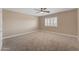 Bedroom with a ceiling fan, carpet flooring and shutters at 13304 W Palo Verde Dr, Litchfield Park, AZ 85340
