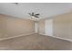 Spacious bedroom with neutral carpet and ceiling fan, offering a comfortable and inviting atmosphere at 13304 W Palo Verde Dr, Litchfield Park, AZ 85340
