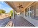 Inviting covered patio with ceiling fans offers a comfortable outdoor living space at 13304 W Palo Verde Dr, Litchfield Park, AZ 85340