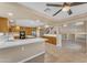Open concept kitchen features stainless appliances, granite countertops, and a center island at 13304 W Palo Verde Dr, Litchfield Park, AZ 85340