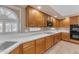 The kitchen features ample cabinet space, quartz countertops, and stainless steel appliances at 13304 W Palo Verde Dr, Litchfield Park, AZ 85340