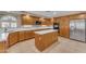 Well-lit kitchen with quartz countertops, ample storage, a center island, and stainless appliances at 13304 W Palo Verde Dr, Litchfield Park, AZ 85340