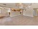 Living room with tile flooring, an open layout, and an adjacent kitchen is perfect for entertaining at 13304 W Palo Verde Dr, Litchfield Park, AZ 85340