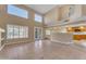 Bright living room boasting lots of natural light, tile flooring, and neutral color palette at 13304 W Palo Verde Dr, Litchfield Park, AZ 85340