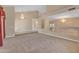 Spacious living room with neutral colors, chandelier, and open floor plan perfect for entertaining at 13304 W Palo Verde Dr, Litchfield Park, AZ 85340
