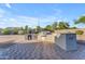 Outdoor kitchen features built-in grill, countertop space and a lovely brick-paver patio area at 13304 W Palo Verde Dr, Litchfield Park, AZ 85340