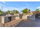 Outdoor kitchen area with a built-in barbecue, granite countertops and ample counter space at 13304 W Palo Verde Dr, Litchfield Park, AZ 85340