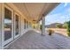 Long covered patio with ceiling fans and beautiful pavers perfect for outdoor entertaining at 13304 W Palo Verde Dr, Litchfield Park, AZ 85340