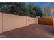 Block wall and wood gate offer privacy in backyard at 1356 E Flamingo Ct, Gilbert, AZ 85297