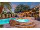 Inviting backyard features a pool, spa, gazebo and lounge chairs, perfect for outdoor entertaining at 1356 E Flamingo Ct, Gilbert, AZ 85297