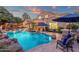 Expansive backyard with a large pool, spa, and outdoor kitchen, ideal for entertaining guests at 1356 E Flamingo Ct, Gilbert, AZ 85297