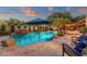 Large pool and spa surrounded by mature landscaping, creating a private backyard retreat at 1356 E Flamingo Ct, Gilbert, AZ 85297