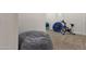 Basement room with gray beanbag chair and exercise equipment at 1356 E Flamingo Ct, Gilbert, AZ 85297