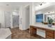 Spacious bathroom with separate tub and shower, double vanities, great lighting, and warm tile flooring at 1356 E Flamingo Ct, Gilbert, AZ 85297