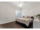 Cozy bedroom with wood floors and a large window bringing in natural light at 1356 E Flamingo Ct, Gilbert, AZ 85297