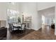 Dining room featuring high ceilings, large windows, and a large decorative cabinet at 1356 E Flamingo Ct, Gilbert, AZ 85297