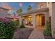 Charming front porch with comfortable seating area, decorative plants, and a beautiful brick walkway at 1356 E Flamingo Ct, Gilbert, AZ 85297