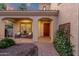 Inviting front porch with seating area, brick flooring, and tasteful landscaping, perfect for relaxing at 1356 E Flamingo Ct, Gilbert, AZ 85297