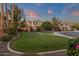 Lush front yard with a curved walkway, mature trees, and well-manicured landscaping create a welcoming entrance at 1356 E Flamingo Ct, Gilbert, AZ 85297