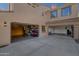 Spacious three-car garage with two open doors, revealing ample storage and parking space, enhancing functionality at 1356 E Flamingo Ct, Gilbert, AZ 85297