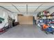 Well-organized garage with ample storage, featuring built-in cabinets, shelving, and a clean epoxy floor at 1356 E Flamingo Ct, Gilbert, AZ 85297