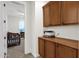 Hallway nook with built-in cabinets and adjacent Bedroom with a crib at 1356 E Flamingo Ct, Gilbert, AZ 85297