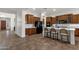 Long view of the kitchen and lots of dark wood cabinets and stainless steel appliances at 1356 E Flamingo Ct, Gilbert, AZ 85297