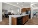Open kitchen with light countertops, dark appliances, and dark wood cabinets at 1356 E Flamingo Ct, Gilbert, AZ 85297