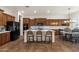 Spacious kitchen featuring stainless steel appliances, central island, and bright countertops at 1356 E Flamingo Ct, Gilbert, AZ 85297