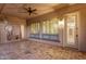 Relaxing covered patio with ceiling fan, pavers, and view of landscaped backyard at 1356 E Flamingo Ct, Gilbert, AZ 85297