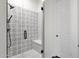 Modern tiled shower with glass enclosure and bench seating at 1356 E Flamingo Ct, Gilbert, AZ 85297