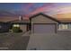 Charming single-story home featuring a two-car garage, desert landscaping, and a welcoming entrance at 14234 N 26Th Ln Ln, Phoenix, AZ 85023