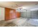Garage with built-in storage cabinets and gray doors at 14234 N 26Th Ln Ln, Phoenix, AZ 85023