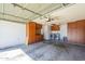 Garage with built-in storage cabinets, laundry area, and overhead lighting at 14234 N 26Th Ln Ln, Phoenix, AZ 85023