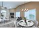 Open-concept living space featuring a dining area, vaulted ceiling, and seamless flow for entertaining at 14234 N 26Th Ln, Phoenix, AZ 85023