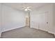 Bedroom featuring a ceiling fan, neutral carpet, and a closet with white sliding doors at 15731 W Redfield Rd, Surprise, AZ 85379
