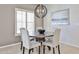 Dining area with a round table, comfortable seating, and a stylish chandelier at 15731 W Redfield Rd, Surprise, AZ 85379
