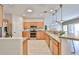 Well-equipped kitchen with stainless steel appliances and a convenient breakfast bar at 15731 W Redfield Rd, Surprise, AZ 85379