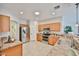 Bright kitchen featuring stainless steel appliances, tile floors, and plenty of cabinet space at 15731 W Redfield Rd, Surprise, AZ 85379