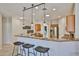 Kitchen with a breakfast bar featuring hanging pendant lights at 15731 W Redfield Rd, Surprise, AZ 85379
