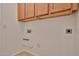 Laundry room featuring upper cabinets and hookups for a washer and dryer at 15731 W Redfield Rd, Surprise, AZ 85379