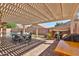 Inviting outdoor patio with pergola, dining area, and grilling station perfect for entertaining at 15731 W Redfield Rd, Surprise, AZ 85379