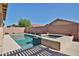 This home features a sparkling pool, spa, and low-maintenance desert landscaping at 15731 W Redfield Rd, Surprise, AZ 85379