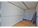 Spacious shed interior featuring clean, metal-lined walls and plywood flooring at 15731 W Redfield Rd, Surprise, AZ 85379