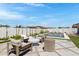 Stylish backyard with a modern pool and lounge area, surrounded by well-maintained landscaping and privacy walls at 17084 N Palo Pino St, Maricopa, AZ 85138
